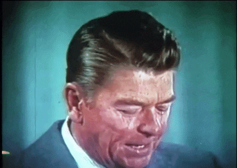 a close up of a man 's face with tears running down his face