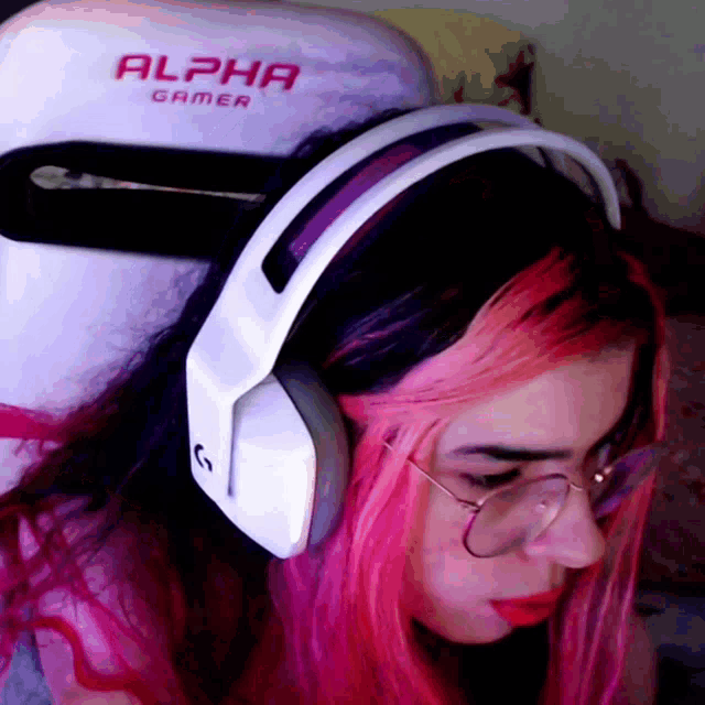 a woman wearing headphones that say alpha gamer