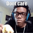 a man wearing headphones and glasses is holding a banana and making a funny face .