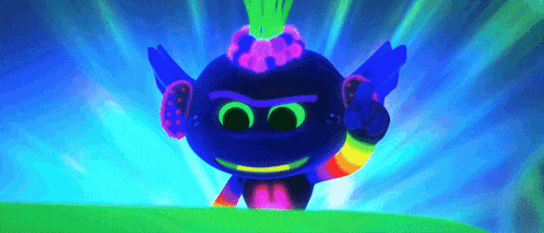 a troll from the movie trolls is glowing in the dark and making a peace sign .