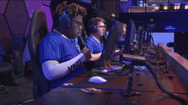 a man wearing headphones and a shirt that says xvzl