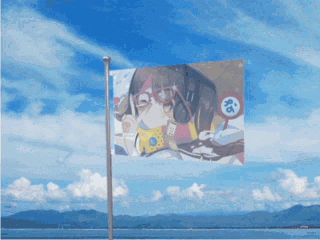 a flag with a picture of a person on it is flying in the wind