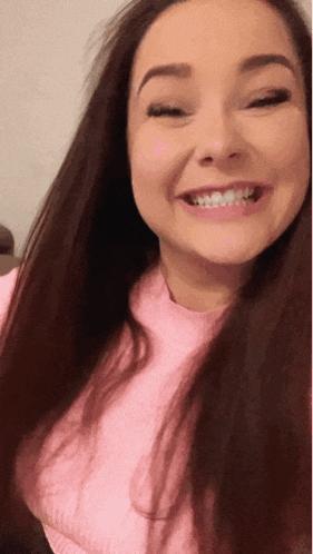 a woman with braces on her teeth is smiling