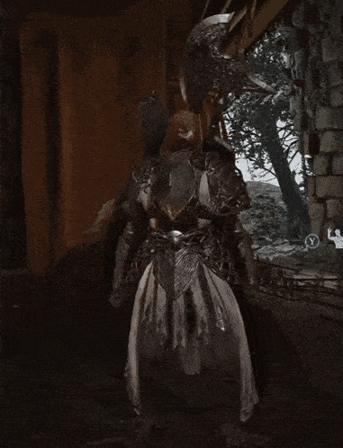 a man in armor is holding a large axe in his hand