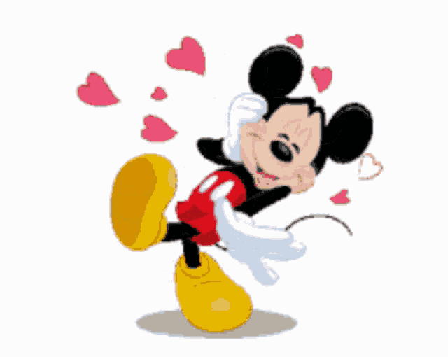 a cartoon drawing of mickey mouse with hearts around him