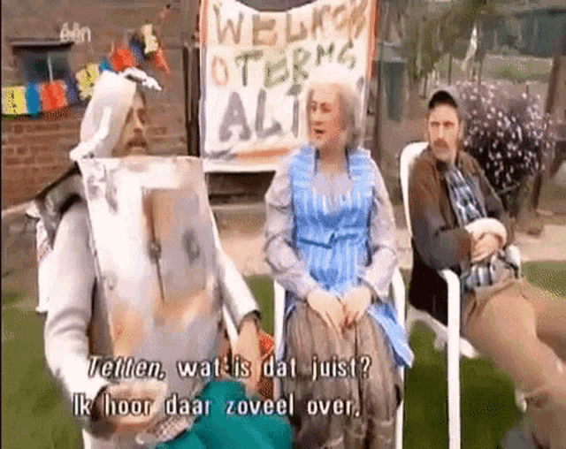 a group of people are sitting in front of a sign that says welkom