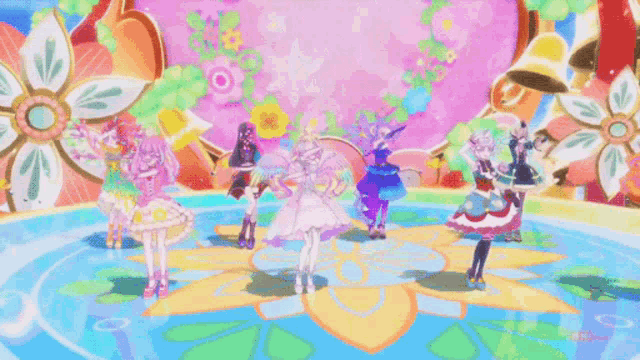 a group of anime characters are dancing on a stage with flowers in the background