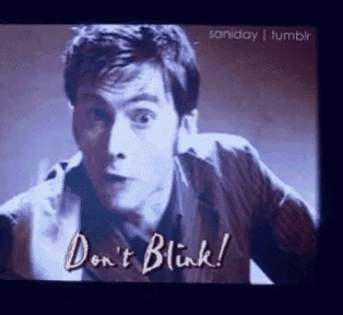 a tv screen shows a man saying " do n't blink ! "