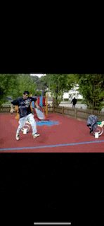 a man is doing a trick on a seesaw at a playground