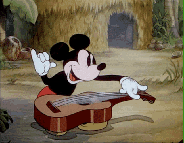 mickey mouse is playing a guitar in a cartoon scene