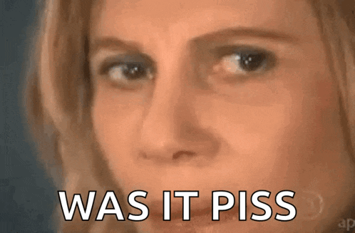 a close up of a woman 's face with the words `` was it piss '' written below her .