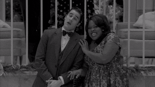 a black and white photo of a man and a woman
