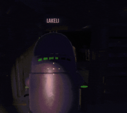 a purple robot is standing in front of a sign that says lakeli