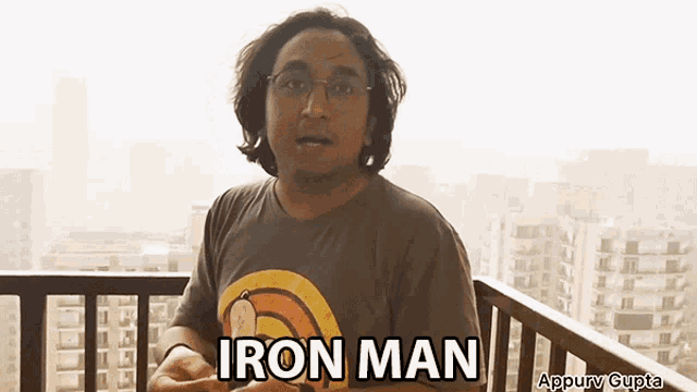 a man wearing a shirt that says iron man
