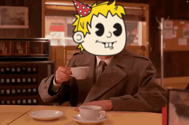 a man in a trench coat is drinking a cup of coffee with a cartoon face on his head