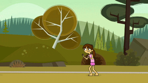 a girl in a pink shirt is standing in front of trees