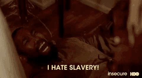 a man is laying on the floor in a bathtub and screaming .