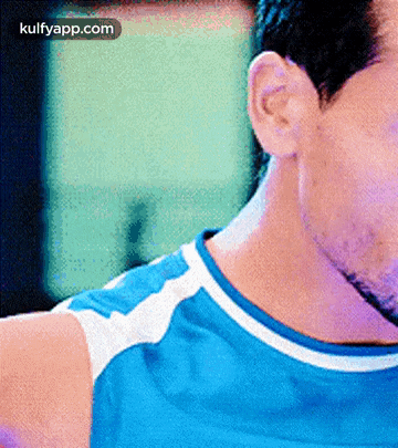 a close up of a man 's neck with the words kulfyapp.com below