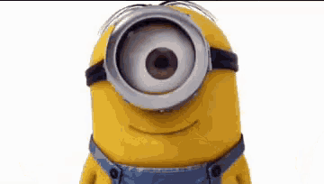 a yellow minion wearing overalls and goggles with a big eye .