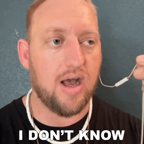 a man with a beard is wearing headphones and says i don t know