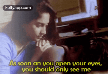 a woman is sitting in front of a computer with the words " as soon as you open your eyes , you should only see me " above her