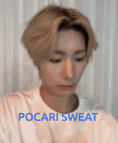 a blurred image of a man with the words pocari sweat on the bottom