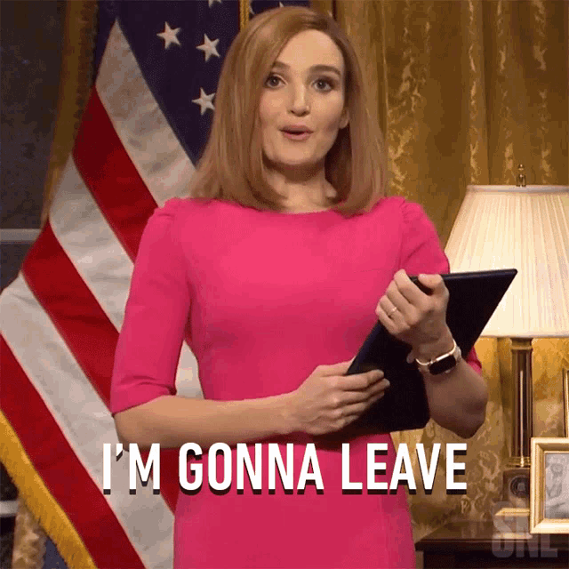 a woman in a pink dress is holding a clipboard and says i 'm gonna leave
