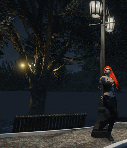 a woman with red hair is leaning against a street light at night