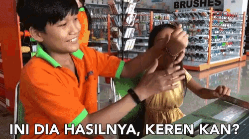 a boy and a girl are playing in a store with the words ini dia hasilnya keren kan written below them