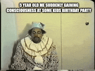 a man in a clown costume is sitting at a table with a funny caption .