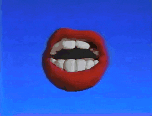 a close up of a woman 's mouth with red lipstick and white teeth
