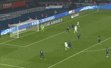 a soccer player is running on the field in front of a msc cruise sign