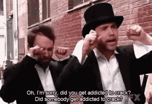 a man in a top hat is talking to another man