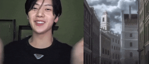 a young man in a black shirt is smiling in front of a cityscape .