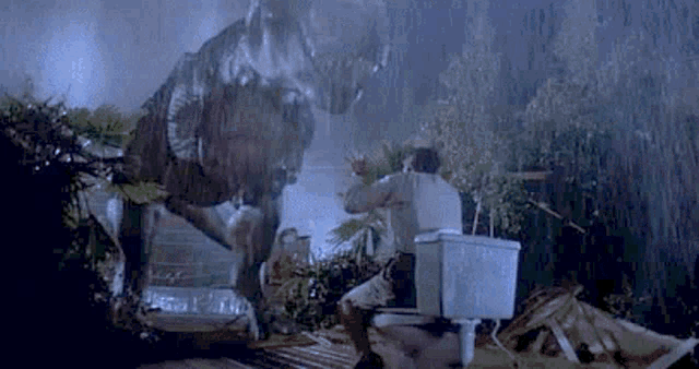 a man is sitting on a toilet in front of a t-rex dinosaur .