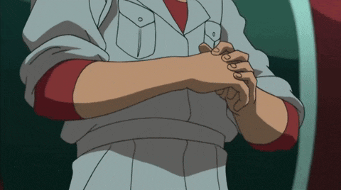 a man with his arms crossed has a red shirt on