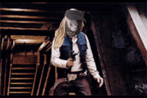 a person with a skull on their face holding a gun in a dark room