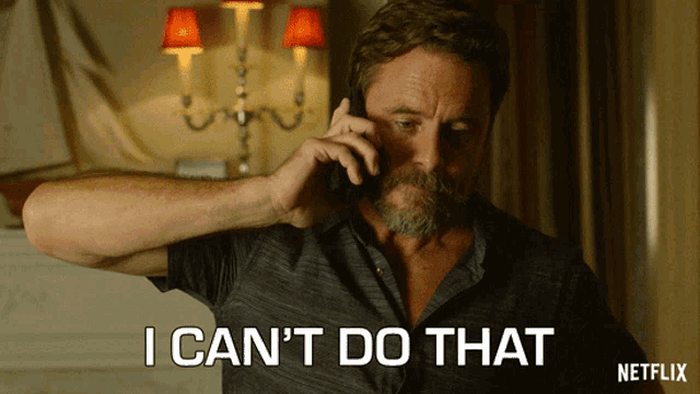 a man talking on a cell phone with the words " i can 't do that " on the bottom