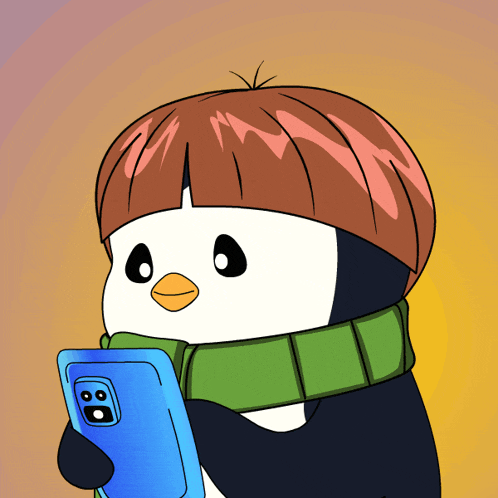 a penguin with a scarf around its neck is holding a cellphone