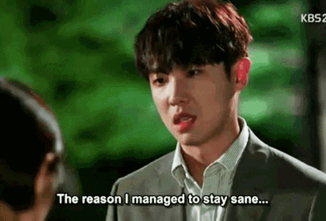 a man in a suit is talking to a woman and says the reason i managed to stay sane ...