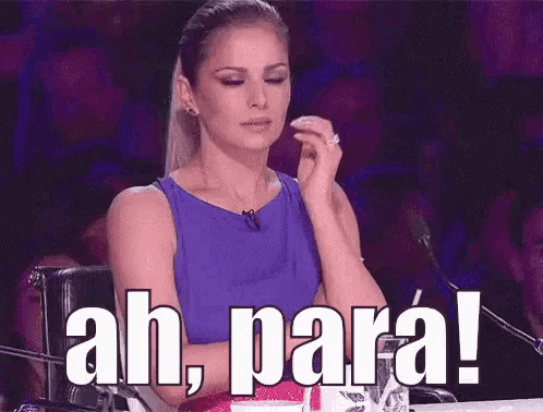 a woman in a purple dress is sitting in front of a microphone with the words ah para !