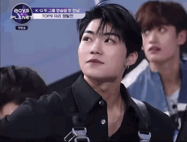 a boys planet show is being played on a screen