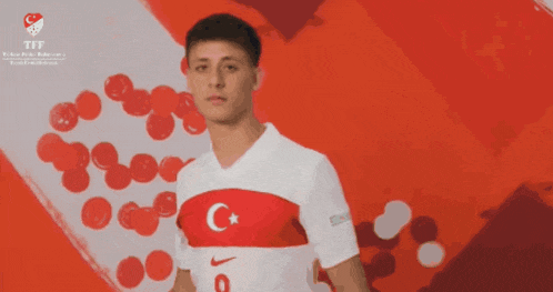 a man wearing a white nike shirt with a c and star on it