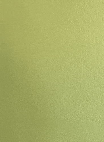 a yellow wall with a white object against it