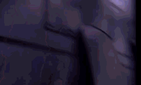 a close up of a purple background with a shadow of a person .
