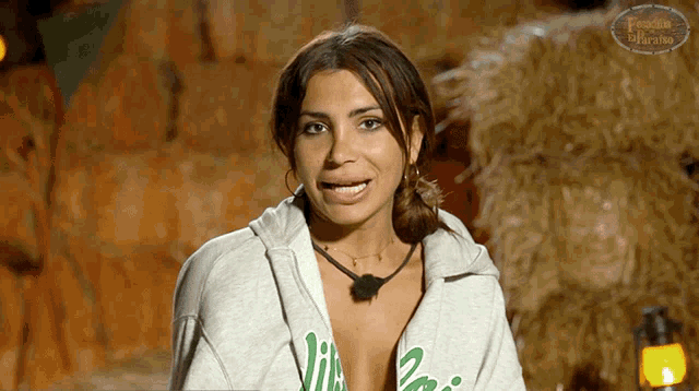 a woman wearing a sweatshirt that says ' i love you ' on the front