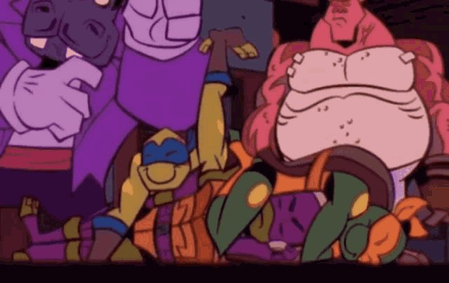 a group of teenage mutant ninja turtles are laying on the floor