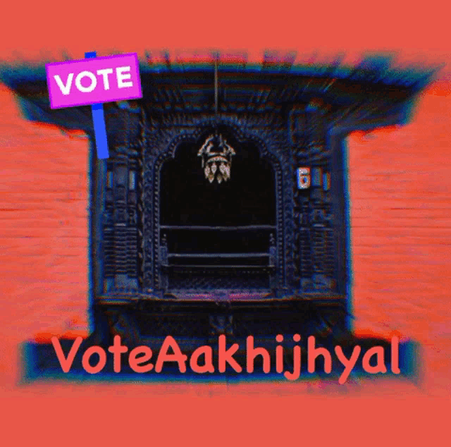 a sign that says vote on it next to a building
