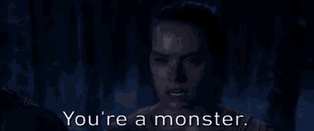 a woman in a dark room with the words you 're a monster below her