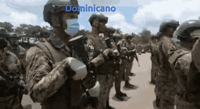 a group of soldiers are standing in a line with the word dominicano on the top
